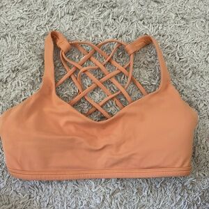 Free to be wild orange Lululemon sports bra size 4